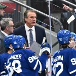 Sep 19, 2026; Toronto, Ontario, CAN; Toronto Maple Leafs head coach Jim Hiller speaks to his players during a time out against the Montreal Canadiens in the third period at Scotiabank Arena