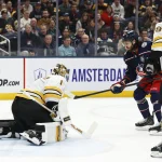 Mar 29, 2026; Columbus, Ohio, USA; Boston Bruins goalie Jeremy Swayman (1) makes a save as Columbus Blue Jackets right wing Kirill Marchenko (86) looks for a rebound during the second period at Nationwide Arena.