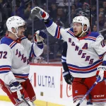 Oct 30, 2023; Winnipeg, Manitoba, CAN; New York Rangers left wing Artemi Panarin (10) celebrates his first period goal against the Winnipeg Jets with teammate New York Rangers center Filip Chytil (72) at Canada Life Centre.