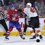 Sep 23, 2025; Montreal, Quebec, CAN; Montreal Canadiens forward Luke Tuch (88) and Philadelphia Flyers defenseman Hunter McDonald (41) fight during the third period at the Bell Centre.
