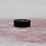Sep 23, 2026; Dallas, Texas, USA; A view of an NHL puck and the Dallas Stars logo during the second period between the Dallas Stars and the Minnesota Wild at the American Airlines Center.