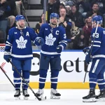 Sep 23, 2026; Toronto, Ontario, CAN; Toronto Maple Leafs defenseman Morgan Rielly (44) celebrates with forward Auston Matthews (34) and defenseman Darren Raddysh (43) after scoring a goal against the Ottawa Senators in the second period at Scotiabank Arena.