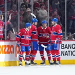 Jan 29, 2026; Montreal, Quebec, CAN; Montreal Canadiens forward Kirby Dach (77) celebrates with teammates after scoring a goal against the Colorado Avalanche during the second period at the Bell Centre.