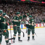 May 9, 2026; Saint Paul, Minnesota, USA; The team celebrates a goal by Minnesota Wild defenseman Brock Faber (7) off a shot by right wing Vladimir Tarasenko (91) in the second period of game three of the second round of the 2026 Stanley Cup Playoffs at Grand Casino Arena.