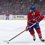 May 27, 2026; Montreal, Quebec, CAN; Montreal Canadiens center Kirby Dach (77) skates with the puck against the Carolina Hurricanes during the first period in game four of the Eastern Conference Final of the 2026 Stanley Cup Playoffs at Bell Centre.
