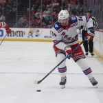 70 players placed on waivers on day before NHL rosters are finalized Mar 7, 2026; Newark, New Jersey, USA; New York Rangers right wing Taylor Raddysh (14) moves the puck up ice against the New Jersey Devils during the third period at Prudential Center.