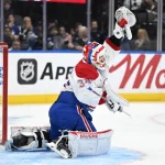 Sep 19, 2026; Toronto, Ontario, CAN; Montreal Canadiens goalie Kaapo Kahkonen (34) makes a glove save against the Toronto Maple Leafs in the third period at Scotiabank Arena.