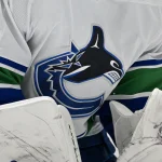 Dec 21, 2023; Dallas, Texas, USA; A view of the Vancouver Canucks logo on the jersey of goaltender Thatcher Demko (35) during the game between the Dallas Stars and the Vancouver Canucks at the American Airlines Center.
