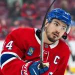 Sep 19, 2026; Montreal, Quebec, CAN; Montreal Canadiens center Nick Suzuki (14) looks on during warm-up before the game against the Toronto Maple Leafs at Bell Centre.