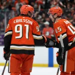 Apr 24, 2026; Anaheim, California, USA; Anaheim Ducks right wing Beckett Sennecke (45) celebrates a win with center Leo Carlsson (91) after defeating the Edmonton Oilers 7-4 in game three of the first round of the 2026 Stanley Cup Playoffs at Honda Center.