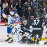 Apr 16, 2026; Salt Lake City, Utah, USA; St. Louis Blues right wing Jordan Kyrou (25), left wing Pavel Buchnevich (89) and center Pius Suter (22) celebrate a goal against the Utah Mammoth by defenseman Logan Mailloux (not shown) during the third period at Delta Center.