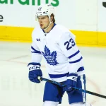 Feb 2, 2026; Calgary, Alberta, CAN; Toronto Maple Leafs left wing Matthew Knies (23) skates during the warmup period against the Calgary Flames at Scotiabank Saddledome.