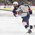 Oct 11, 2025; Saint Paul, Minnesota, USA; Columbus Blue Jackets forward Kirill Marchenko (86) completes the hat trick against the Minnesota Wild on this power play goal during the third period at Grand Casino Arena.: