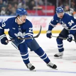 Sep 19, 2026; Toronto, Ontario, CAN; Toronto Maple Leafs forward Matthew Knies (23) shouts for a pass as he leads forward Auston Matthews (34) up ice against the Montreal Canadiens in the third period at Scotiabank Arena.
