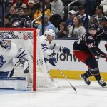 Dec 29, 2023; Columbus, Ohio, USA; Columbus Blue Jackets right wing Kirill Marchenko (86) picks up a loose puck against the Toronto Maple Leafs during the first period at Nationwide Arena.