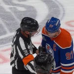 Connor McDavid talking with ref