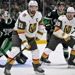 Mar 22, 2026; Dallas, Texas, USA; Vegas Golden Knights right wing Mark Stone (61) looks for the puck in front of Dallas Stars goaltender Casey DeSmith (1) during the third period at the American Airlines Center.