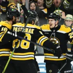 Mar 17, 2025; Boston, Massachusetts, USA; Boston Bruins center Morgan Geekie (39) is congratulated by Boston Bruins center Pavel Zacha (18) right wing David Pastrnak (88) and defenseman Henri Jokiharju (20) after scoring a goal during the first period against the Buffalo Sabres at TD Garden. Mandatory Credit: Bob DeChiara-Imagn Images