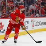 Mar 28, 2026; Detroit, Michigan, USA; Detroit Red Wings center Dylan Larkin (71) skates with the puck in the first period against the Philadelphia Flyers at Little Caesars Arena.