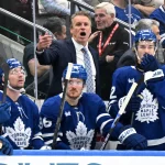 Sep 29, 2026; Toronto, Ontario, CAN; Toronto Maple Leafs head coach Jim Hiller speaks to his players in the third period against the Montreal Canadiens at Scotiabank Arena.