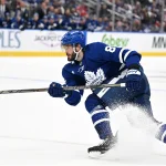 Sep 29, 2026; Toronto, Ontario, CAN; Toronto Maple Leafs forward Kirill Marchenko (86) shoots the puck against the Montreal Canadiens in the third period at Scotiabank Arena.