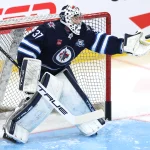 Dec 29, 2025; Winnipeg, Manitoba, CAN; Winnipeg Jets goaltender Connor Hellebuyck (37) warms up before a game against the Edmonton Oilers at Canada Life Centre. Mandatory Credit: James Carey Lauder-Imagn Images