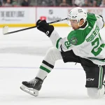 Sep 25, 2026; Saint Paul, Minnesota, USA; Dallas Stars forward Jason Robertson (21) shoots the puck against the Minnesota Wild during the first period at Grand Casino Arena.