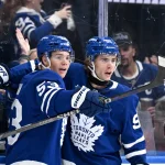 Sep 30, 2026; Toronto, Ontario, CAN; Toronto Maple Leafs forward Easton Cowan (53) celebrates with forward Gavin McKenna (92) after scoring a goal against the New York Islanders in the first period at Scotiabank Arena.
