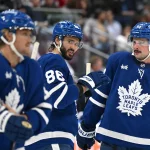 Sep 29, 2026; Toronto, Ontario, CAN; Toronto Maple Leafs forward Kirill Marchenko (86) speaks with forward Auston Matthews (34) during a time out against the Montreal Canadiens in the first period at Scotiabank Arena.