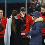 Feb 22, 2026; Milan, Italy; Sidney Crosby (87) of Canada receives the silver medal after the men's ice hockey gold medal against the United States game during the Milano Cortina 2026 Olympic Winter Games at Milano Santagiulia Ice Hockey Arena.