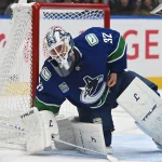 Sep 26, 2026; Vancouver, British Columbia, CAN; Vancouver Canucks goaltender Kevin Lankinen (32) loses his glove against the Seattle Kraken during the second period at Rogers Arena.