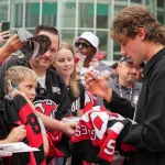 Jack Hughes draws criticism after red carpet video involving fans leaks publicly Oct 1, 2026; Newark, New Jersey, USA; New Jersey Devils center Jack Hughes (86) signs autographs for fans prior to the start of their game against the Philadelphia Flyers at Prudential Center. Mandatory Credit: Ed Mulholland-Imagn Images