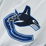 Nov 12, 2023; Montreal, Quebec, CAN; View of a Vancouver Canucks logo on a jersey worn by a member of the team against the Montreal Canadiens during the second period at Bell Centre.