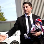 Oct 1, 2026; Columbus, Ohio, USA; Columbus' Zach Werenski carries his son during the Blue Carpet player arrivals before the game between the Buffalo Sabres and the Columbus Blue Jackets at Nationwide Arena.