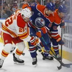 Oilers expected to bench stunning player as insider Bob Stauffer hints at another change Sep 26, 2026; Edmonton, Alberta, CAN; Calgary Flames forward Ryan Strome (22) and Edmonton Oilers defensemen Shakir Mukhamadullin (85) battle along the boards for a loose puck during the second period at Rogers Place. Mandatory Credit: Perry Nelson-Imagn Images