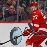 Apr 7, 2026; Detroit, Michigan, USA; Detroit Red Wings defenseman Simon Edvinsson (77) passes in the first period against the Columbus Blue Jackets at Little Caesars Arena.