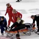 KHL referee stretchered off the ice