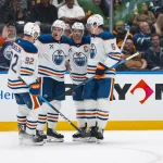Oct 1, 2026; Vancouver, British Columbia, CAN; Edmonton Oilers forward Vasily Podkolzin (92) and defenseman Ryan Shea (6) and forward Connor McDavid (97) and defenseman Connor Murphy (5) celebrate Shea's goal against the Vancouver Canucks in the first period at Rogers Arena.