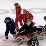 A terrifying scene unfolds as KHL official is stretchered off the ice