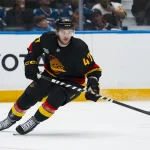 Oct 4, 2026; Vancouver, British Columbia, CAN; Vancouver Canucks forward Paul Cotter (47) skates against the Vegas Golden Knights in the second period at Rogers Arena. :