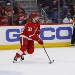 Oct 2, 2026; Detroit, Michigan, USA; Detroit Red Wings right wing Alex DeBrincat (93) skates with the puck in the first period against the New York Rangers at Little Caesars Arena.