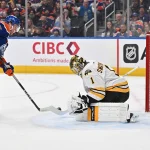 Dec 31, 2025; Edmonton, Alberta, CAN; Edmonton Oilers center Connor McDavid (97) shoots the puck on Boston Bruins goalie Jeremy Swayman (1) during the first period at Rogers Place.
