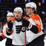 Jan 29, 2026; Boston, Massachusetts, USA; Philadelphia Flyers right wing Nikita Grebenkin (29) is congratulated by right wing Travis Konecny (11) after scoring a goal during the second period at TD Garden.
