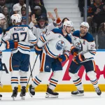 Oct 1, 2026; Vancouver, British Columbia, CAN; Edmonton Oilers defenseman Evan Bouchard (2) and forward Connor McDavid (97) and forward Vasily Podkolzin (92) and forward Leon Draisaitl (29) celebrate Draisaitl's goal against the Vancouver Canucks in the third period at Rogers Arena.