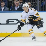 Sep 23, 2025; New York, New York, USA; Boston Bruins center Matthew Poitras (51) carries the puck during the first period of a preseason game against the New York Rangers at Madison Square Garden.