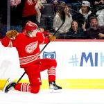 Dec 28, 2025; Detroit, Michigan, USA; Detroit Red Wings defenseman Simon Edvinsson (77) celebrates after scoring in overtime against the Toronto Maple Leafs at Little Caesars Arena.