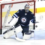 Mar 2, 2018; Winnipeg, Manitoba, CAN; Winnipeg Jets goaltender Connor Hellebuyck (37) warms up before tonight's game against Detroit Red Wings at Bell MTS Place.