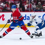 Apr 26, 2026; Montreal, Quebec, CAN; Montreal Canadiens right wing Ivan Demidov (93) plays the puck against Tampa Bay Lightning center Anthony Cirelli (71) during the third period in game four of the first round of the 2026 Stanley Cup Playoffs at Bell Centre.