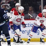 Feb 4, 2026; Winnipeg, Manitoba, CAN; Montreal Canadiens defenseman Lane Hutson (48) celebrates a goal against the Winnipeg Jets in the second period at Canada Life Centre.
