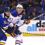 Dec 19, 2016; St. Louis, MO, USA; Edmonton Oilers center Connor McDavid (97) is pressured by St. Louis Blues left wing David Perron (57) during the first period at Scottrade Center.